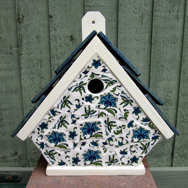 My first attempt at Pique Assiette mosaic which was to save a knackered ornamental bird box, and...