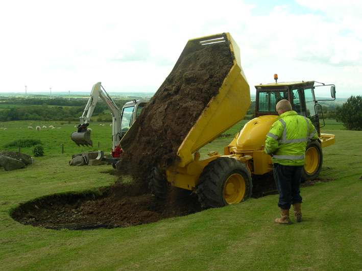 Tipping in the new topsoil. June 2011